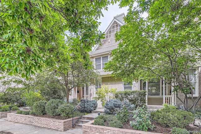 222 S Monroe St, Denver, CO 80209 - view of property hidden behind natural elements with a chimney and brick siding