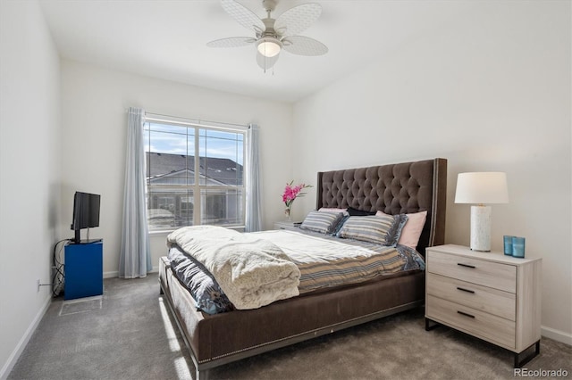 bedroom featuring dark carpet and ceiling fan