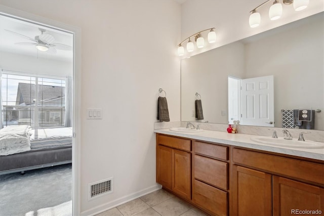 bathroom with ceiling fan, vanity, and tile patterned flooring