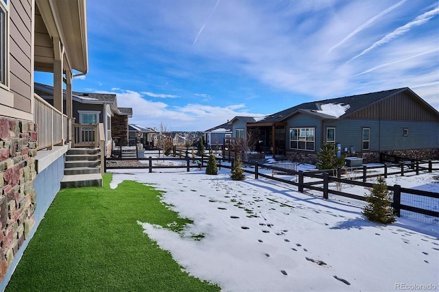 view of yard layered in snow