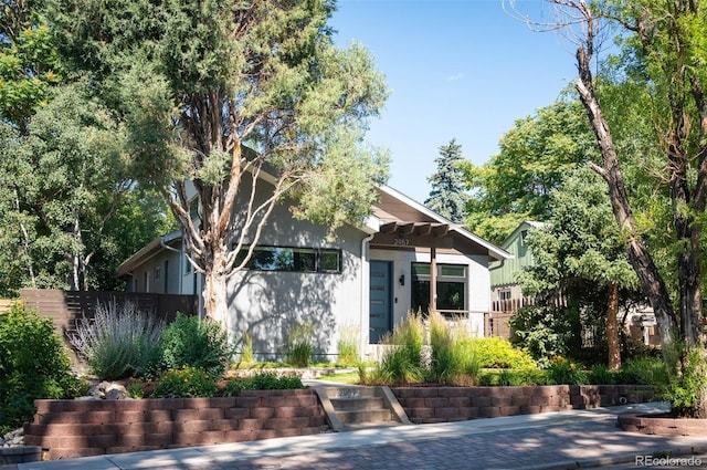 view of front of house with fence