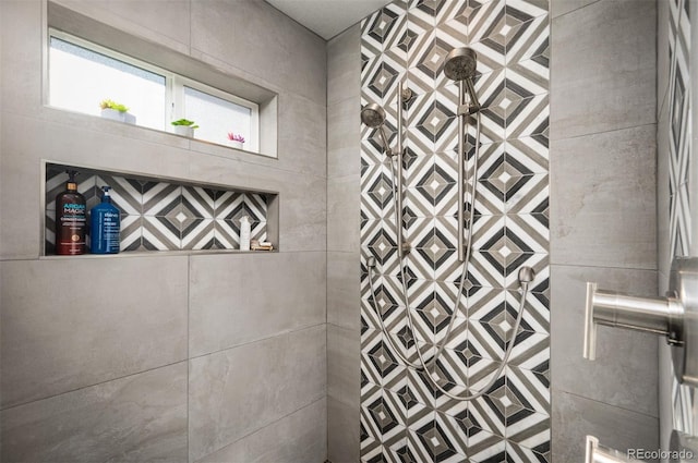 bathroom with tiled shower