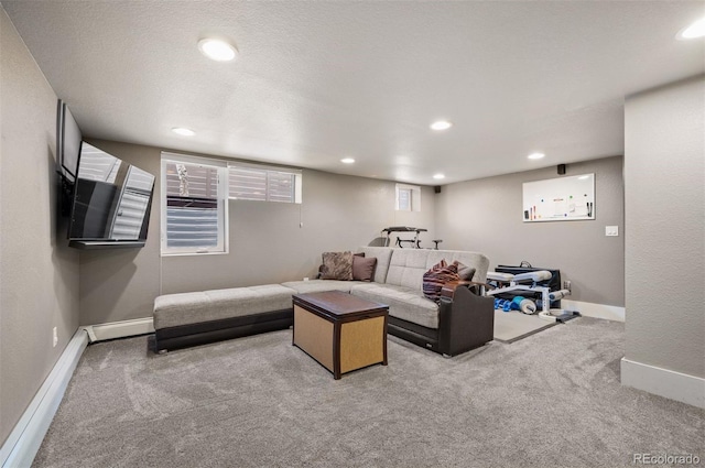 carpeted living room featuring baseboard heating, recessed lighting, a textured ceiling, and baseboards