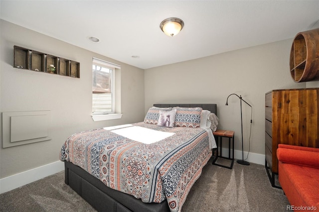 carpeted bedroom featuring baseboards