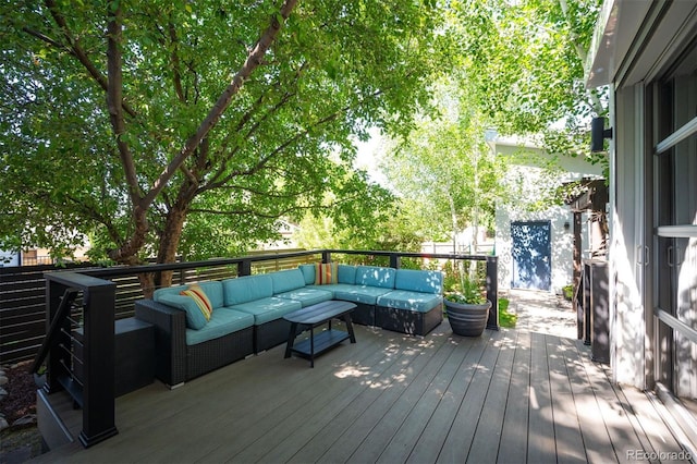 wooden terrace featuring outdoor lounge area