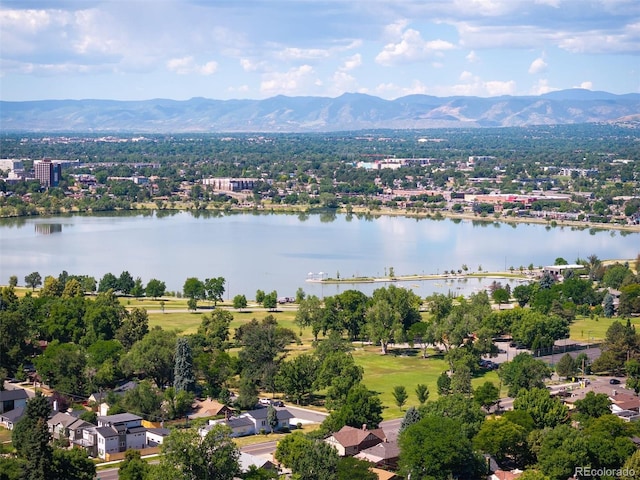 drone / aerial view with a water and mountain view