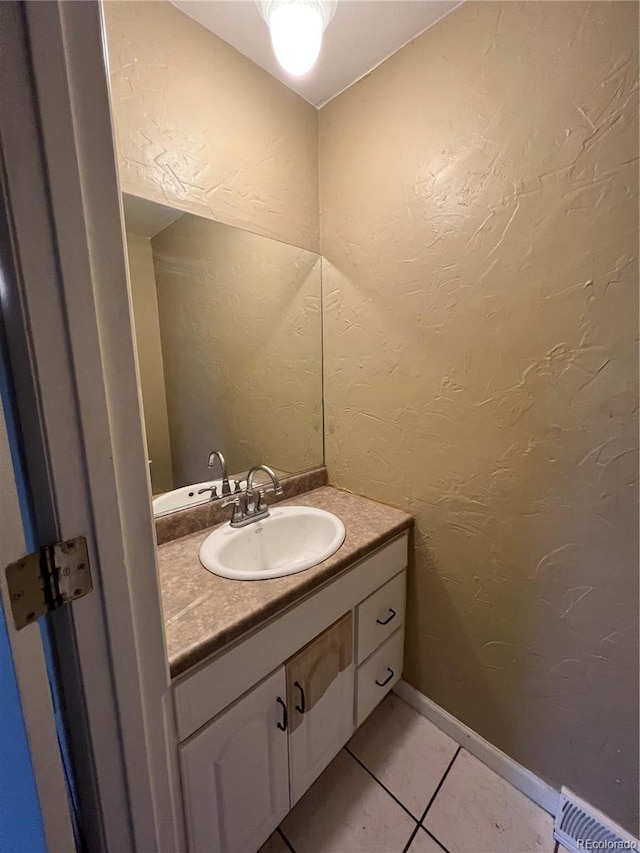 bathroom with vanity and tile patterned floors