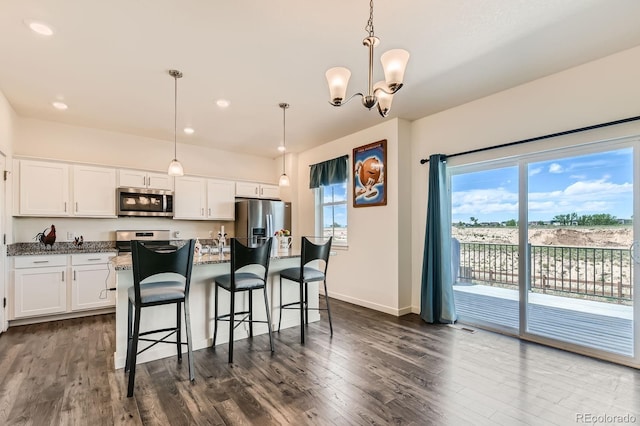 2417 Mountain Sky Dr, Fort Lupton, CO 80621 - kitchen featuring appliances with stainless steel finishes, plenty of natural light, white cabinetry, and recessed lighting