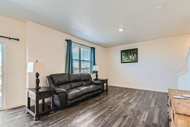 2417 Mountain Sky Dr, Fort Lupton, CO 80621 - living area with dark wood-type flooring and baseboards