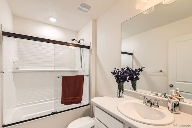 2417 Mountain Sky Dr, Fort Lupton, CO 80621 - bathroom with shower / bath combination with glass door, toilet, vanity, and recessed lighting