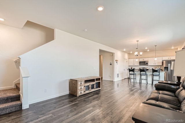 2417 Mountain Sky Dr, Fort Lupton, CO 80621 - living room featuring dark wood-style floors, recessed lighting, stairs, and baseboards