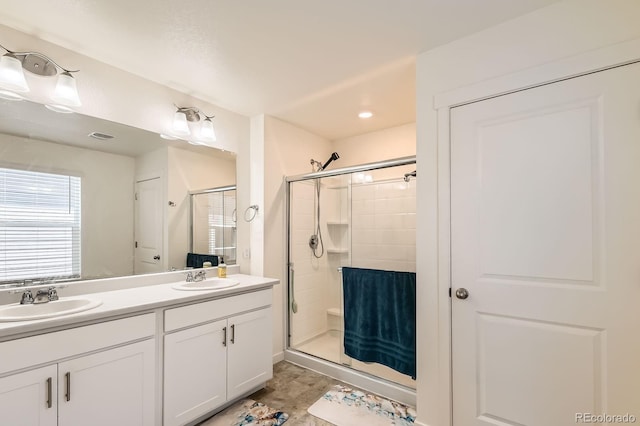 2417 Mountain Sky Dr, Fort Lupton, CO 80621 - bathroom featuring a shower stall and double vanity