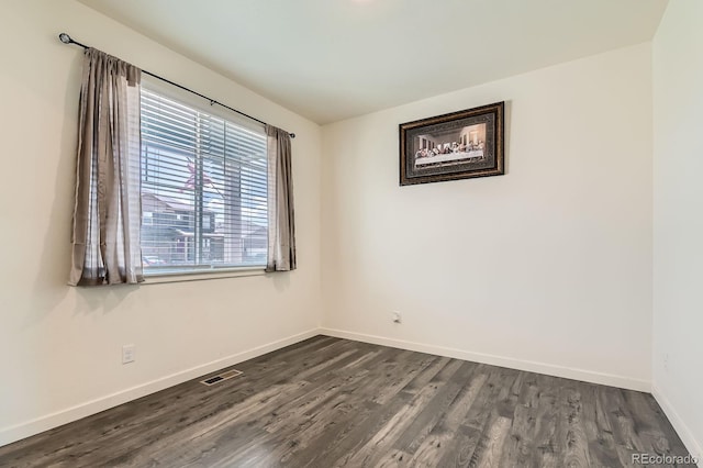 2417 Mountain Sky Dr, Fort Lupton, CO 80621 - spare room with dark wood finished floors and baseboards