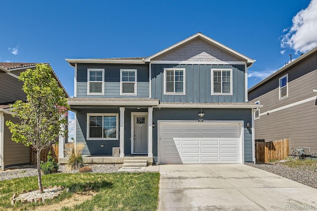 2417 Mountain Sky Dr, Fort Lupton, CO 80621 - view of front of house featuring concrete driveway, board and batten siding, a garage, and a porch