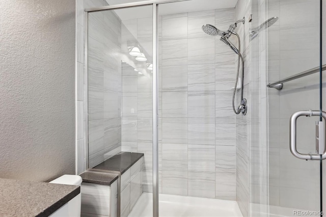 bathroom with vanity and walk in shower