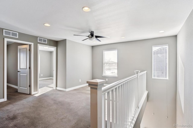 hallway with carpet