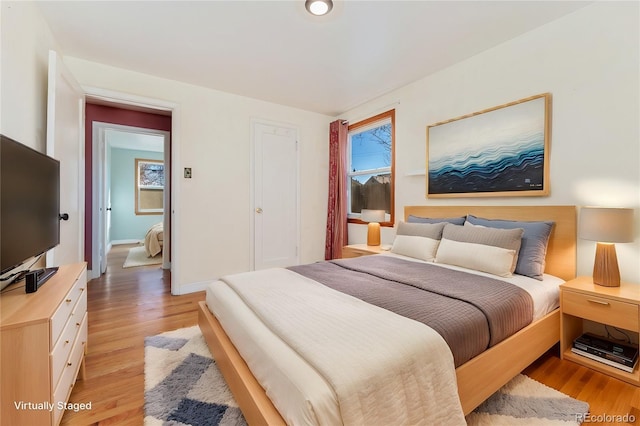 bedroom with light wood-style floors