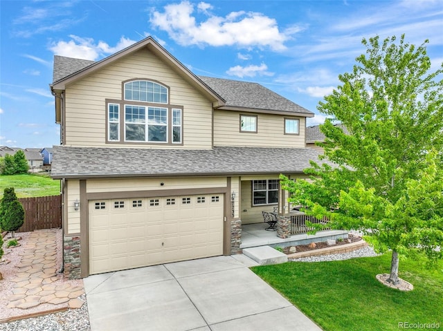 7735 Braxton Dr, Fountain, CO 80817 - view of front of home featuring concrete driveway, a shingled roof, an attached garage, and stone siding