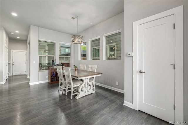 dining space with recessed lighting, dark wood finished floors, and baseboards