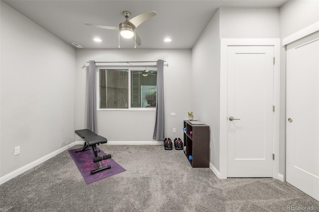 workout room featuring carpet, baseboards, and a ceiling fan