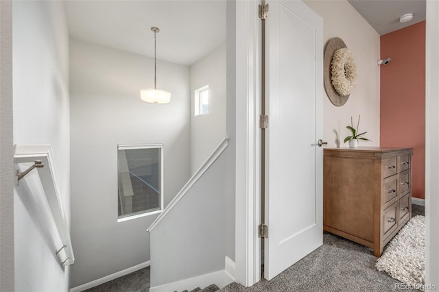 stairway with carpet floors and baseboards