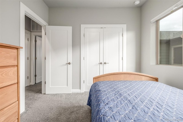 bedroom with a closet and carpet flooring