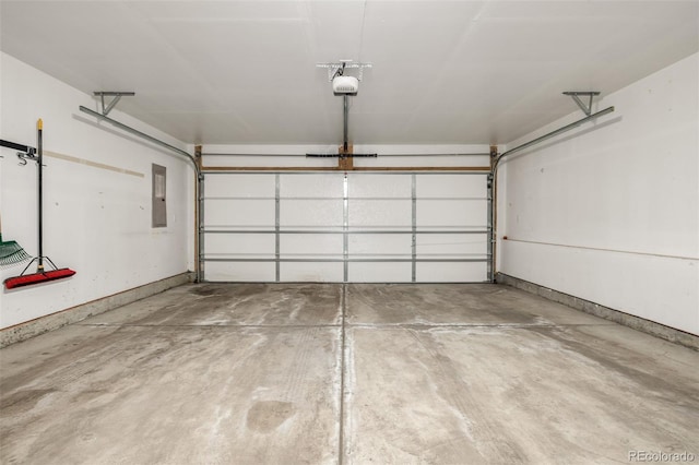 garage featuring a garage door opener and electric panel