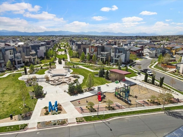 drone / aerial view featuring a residential view and a mountain view