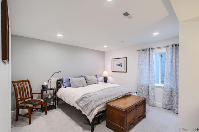 bedroom with recessed lighting, light carpet, and visible vents