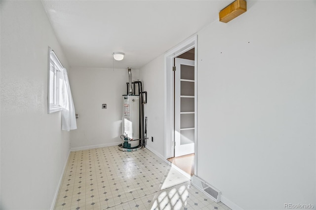 15071 County Road 306, Buena Vista, CO 81211 - corridor featuring water heater, light floors, and baseboards