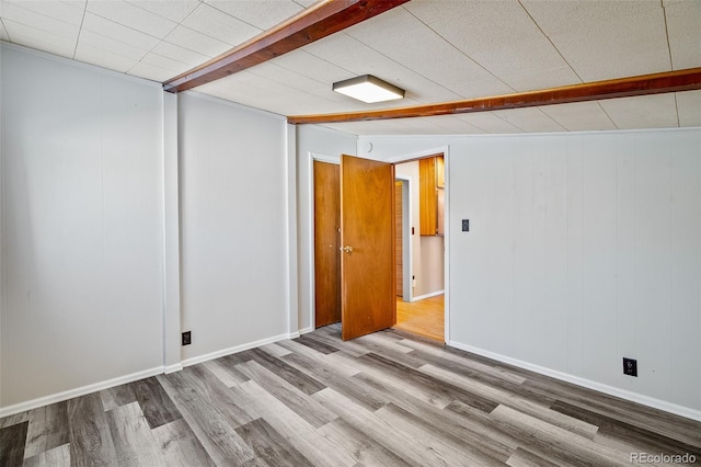 15071 County Road 306, Buena Vista, CO 81211 - unfurnished room featuring wood finished floors, beamed ceiling, and baseboards