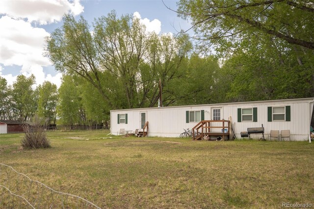 15071 County Road 306, Buena Vista, CO 81211 - rear view of property featuring a yard and a wooden deck