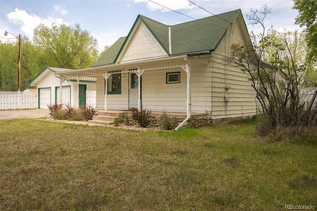 15071 County Road 306, Buena Vista, CO 81211 - view of front of home with a porch, a shingled roof, driveway, and a garage