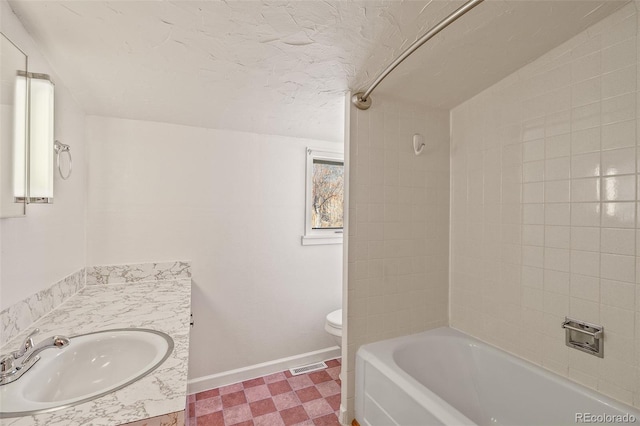 15071 County Road 306, Buena Vista, CO 81211 - bathroom with vanity, toilet, baseboards, shower / tub combination, and tile patterned floors