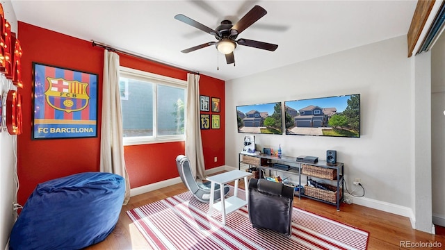 9992 Cottoncreek Dr, Highlands Ranch, CO 80130 - sitting room with wood finished floors and a ceiling fan