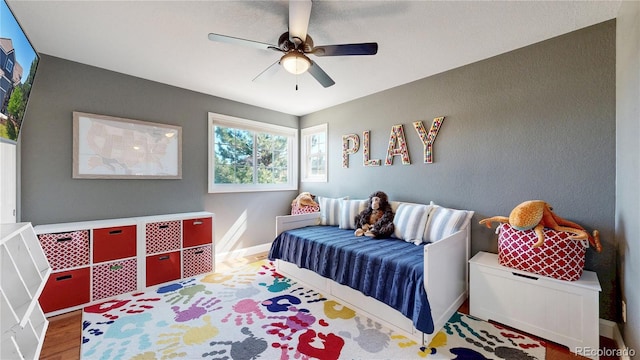 9992 Cottoncreek Dr, Highlands Ranch, CO 80130 - bedroom with wood finished floors and a ceiling fan