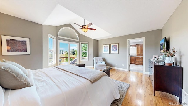 9992 Cottoncreek Dr, Highlands Ranch, CO 80130 - bedroom with light wood-style flooring, lofted ceiling, connected bathroom, and ceiling fan