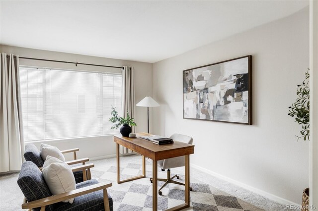 office featuring light colored carpet and baseboards