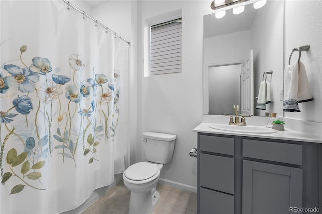 bathroom featuring tile patterned flooring, toilet, vanity, a shower with shower curtain, and baseboards