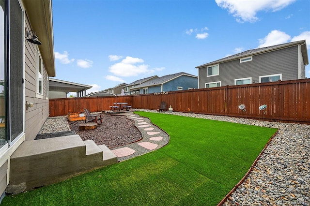 view of yard with a patio and a residential view