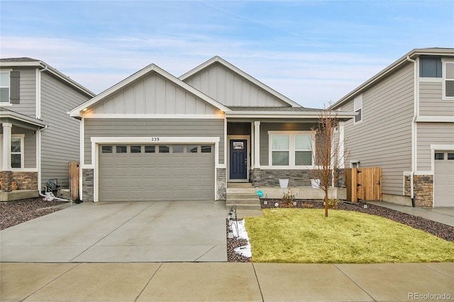 craftsman house with a garage and a front yard