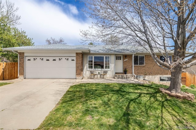 single story home featuring brick siding, fence, and concrete driveway