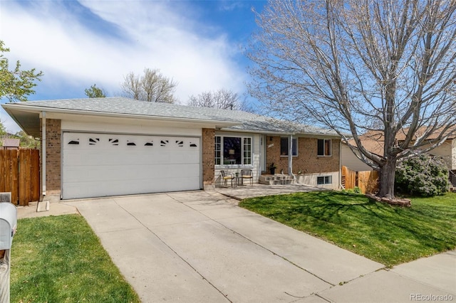ranch-style house featuring a garage, fence, concrete driveway, and brick siding
