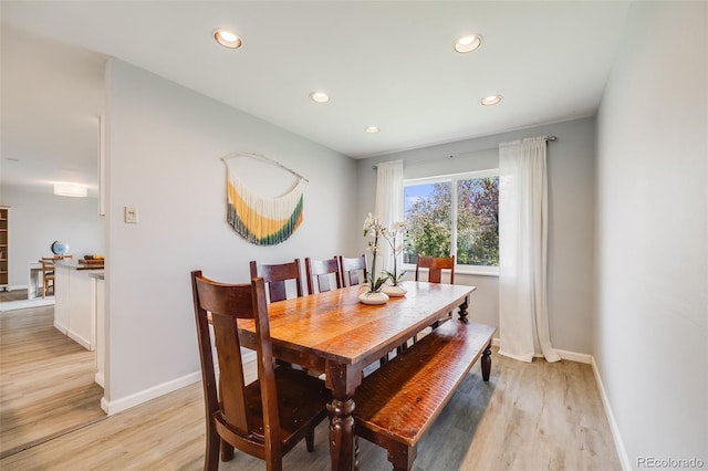 dining area with recessed lighting, baseboards, and light wood-type flooring