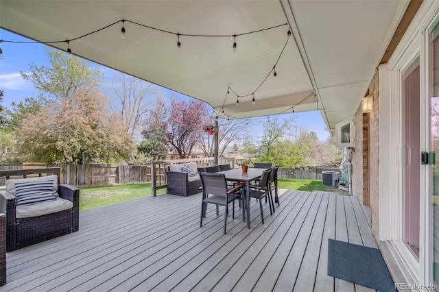 deck featuring outdoor dining space, central AC, a fenced backyard, an outdoor living space, and a yard