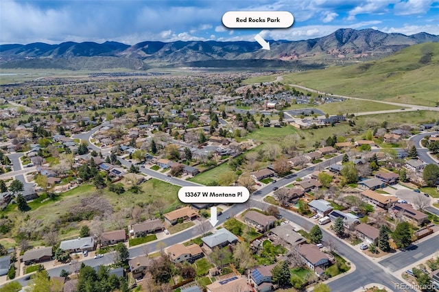 drone / aerial view featuring a residential view and a mountain view