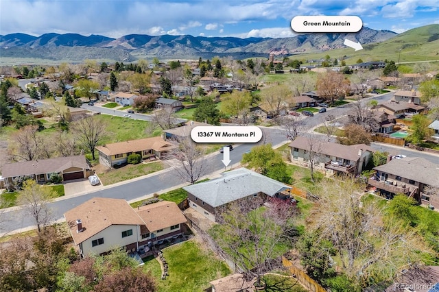birds eye view of property featuring a residential view and a mountain view