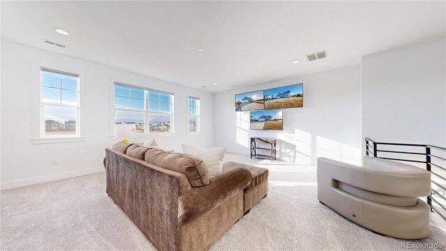 885 Delechant Dr, Erie, CO 80516 - living area with light carpet, recessed lighting, visible vents, and baseboards