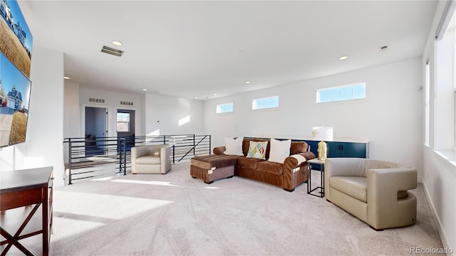 885 Delechant Dr, Erie, CO 80516 - living room with light carpet, a healthy amount of sunlight, visible vents, and recessed lighting