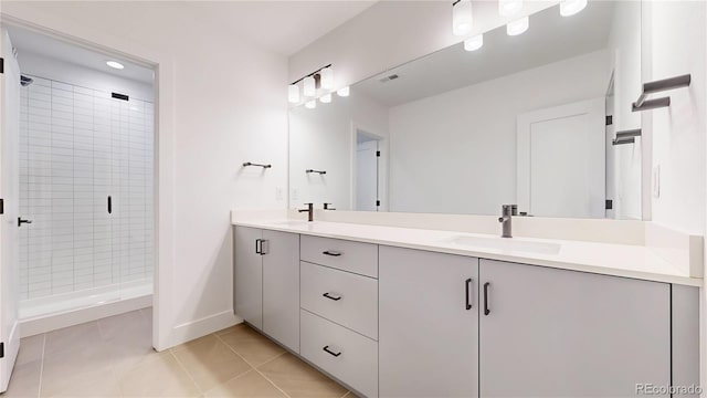 885 Delechant Dr, Erie, CO 80516 - full bath with a stall shower, double vanity, a sink, and tile patterned floors